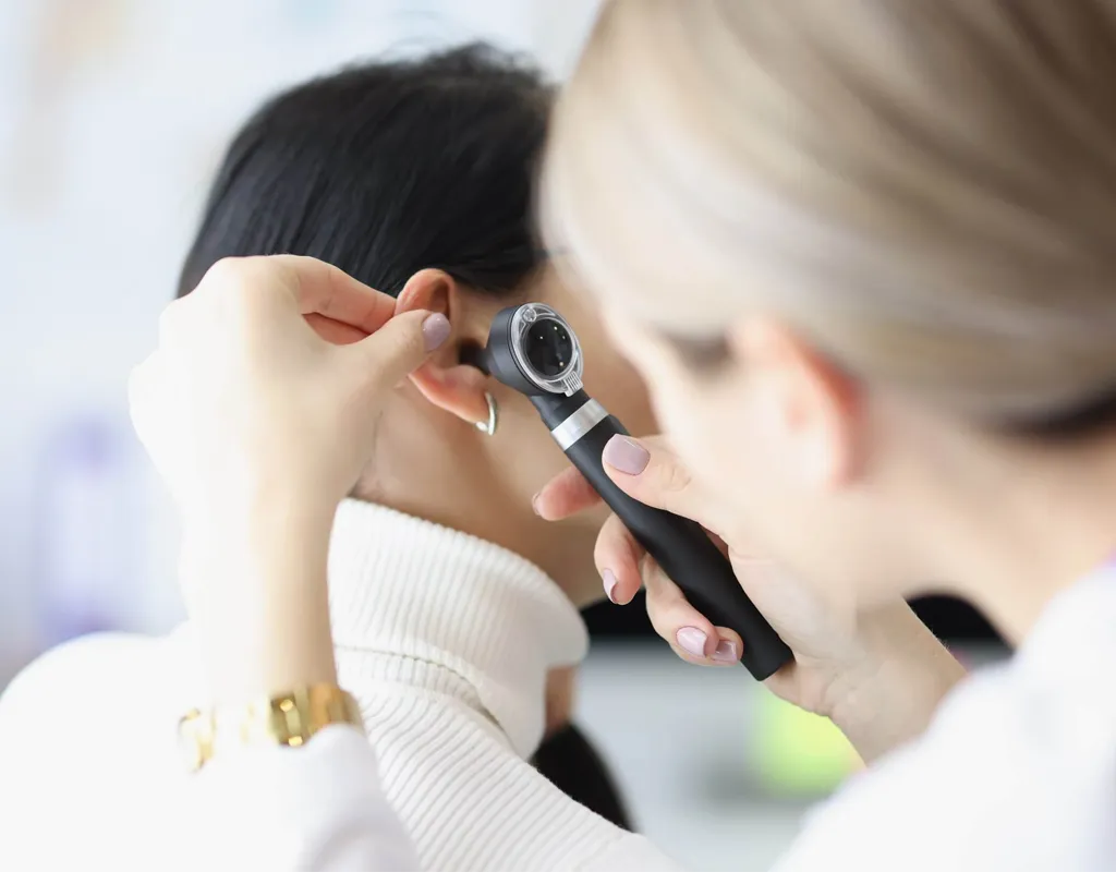 Otoscope ear examination before ear wax removal
